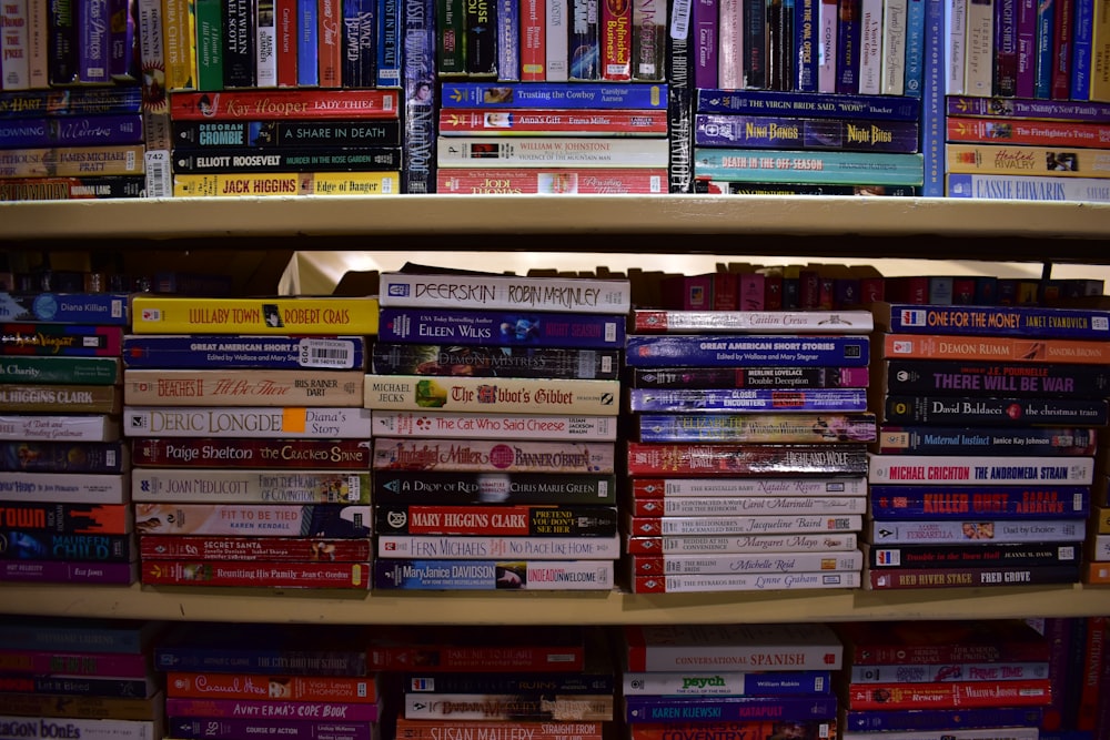 books on brown wooden shelf