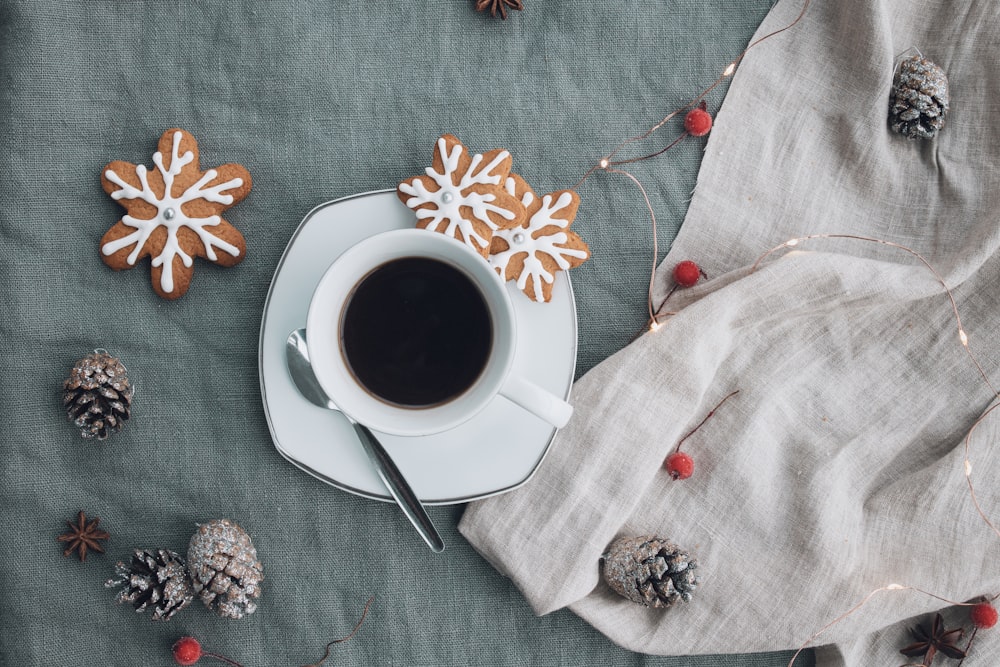 white ceramic mug on white ceramic saucer