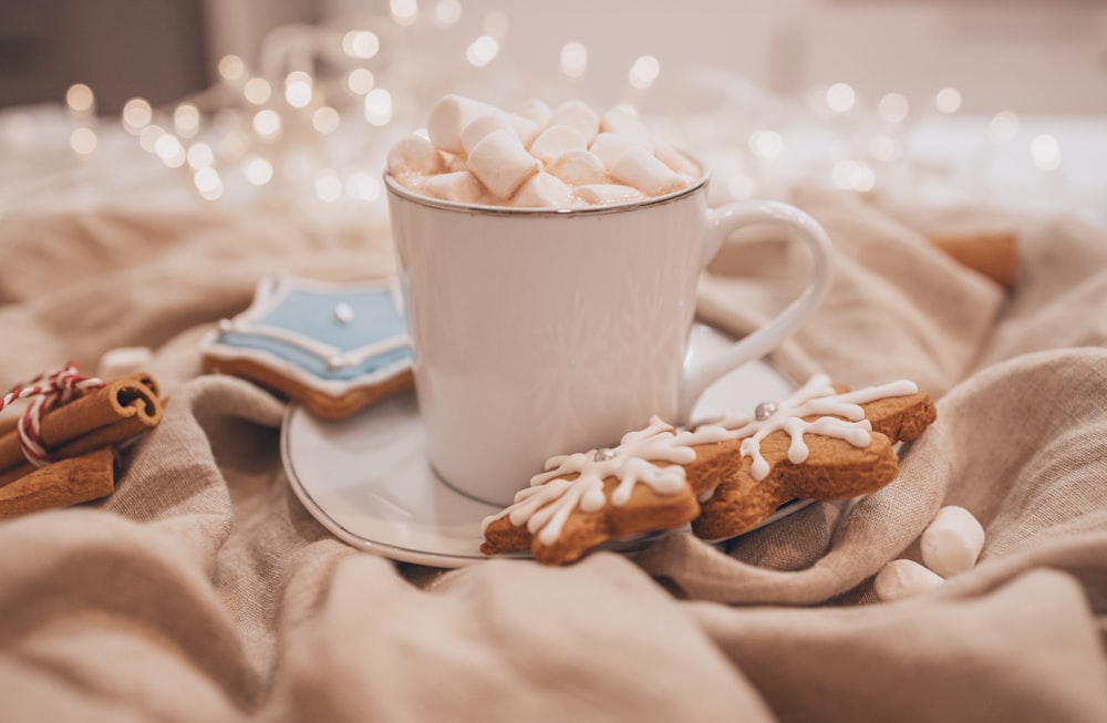 white ceramic mug on white ceramic saucer