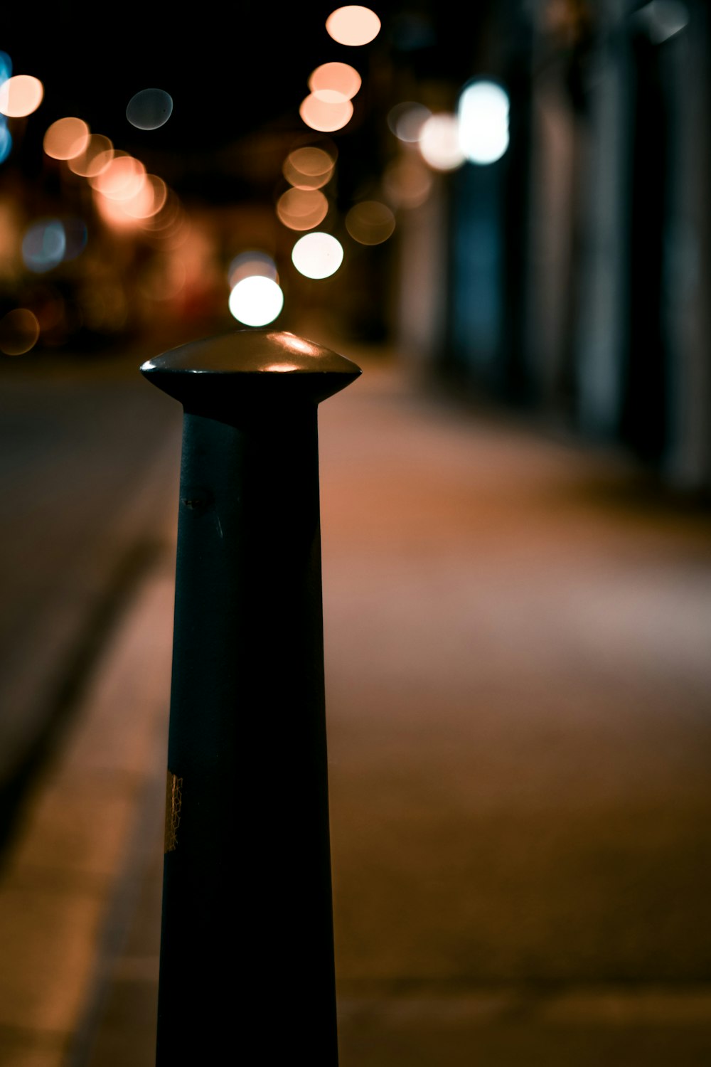 black post lamp turned on during night time