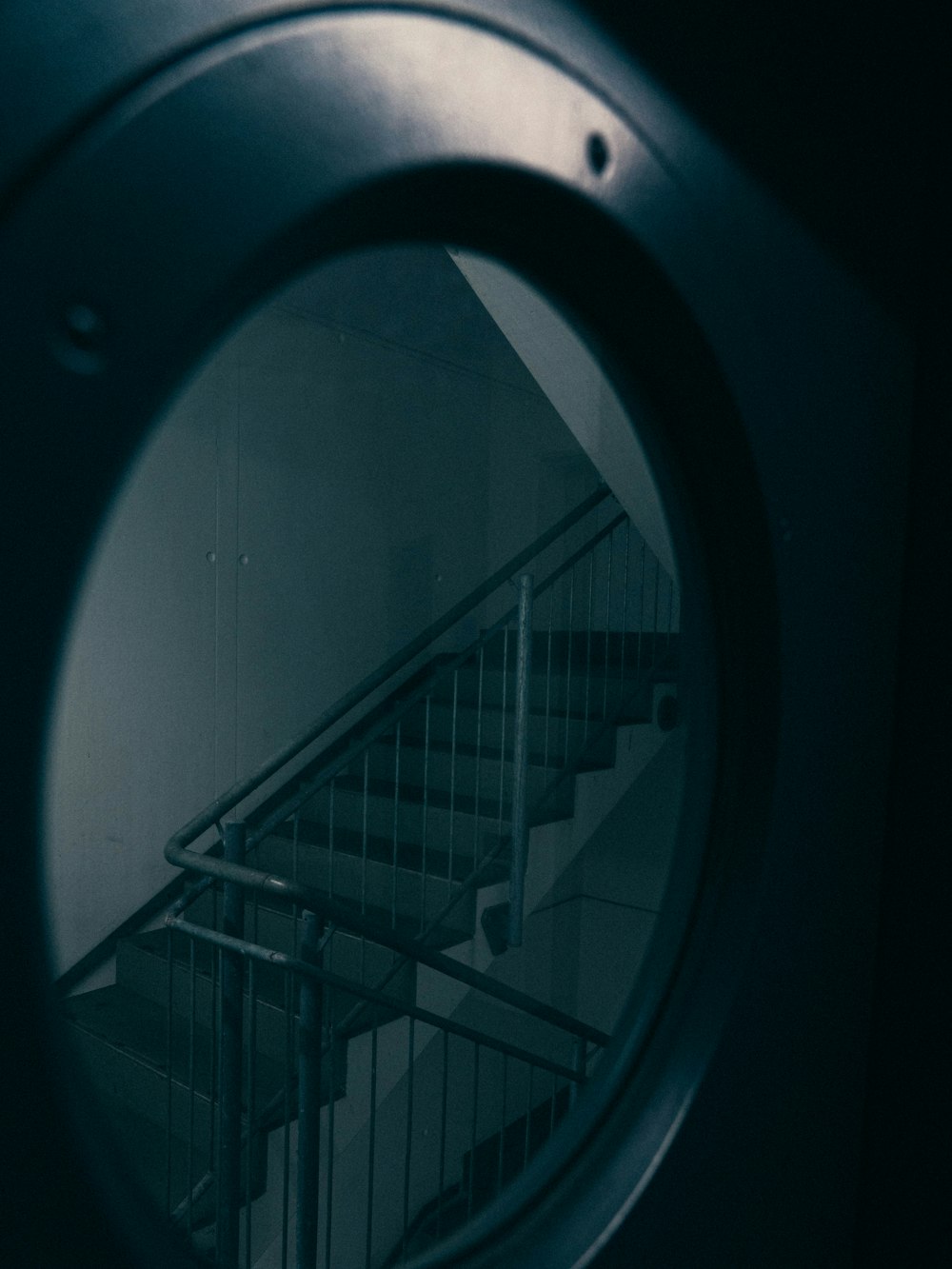 white metal staircase with white railings