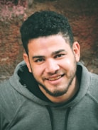 Portrait photo of Hazem Hamdi smiling in a casual setting.