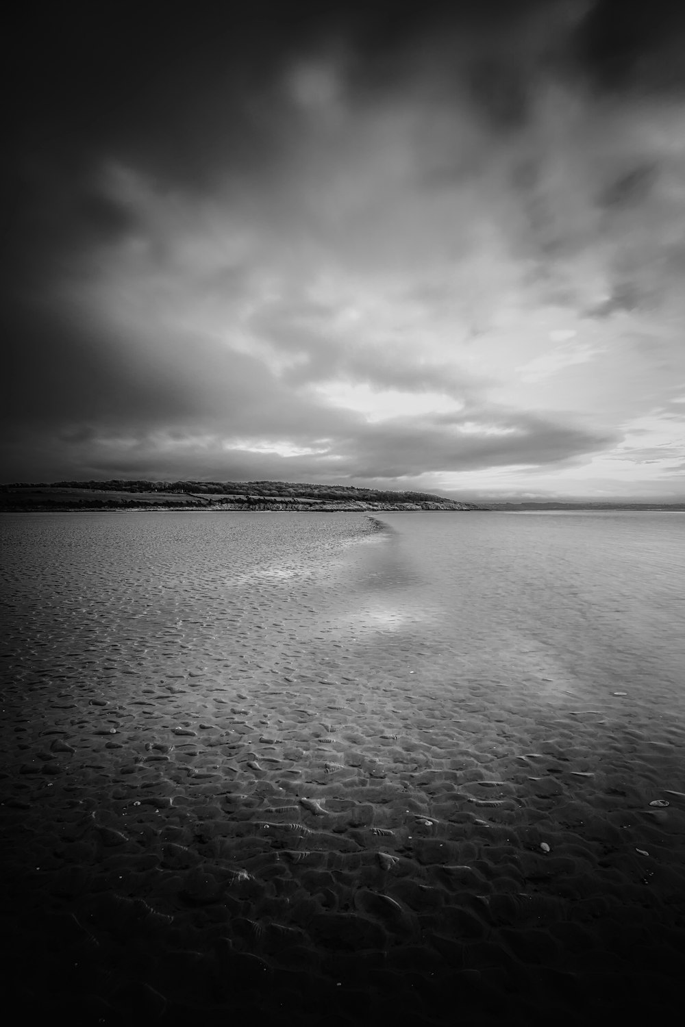 grayscale photo of body of water