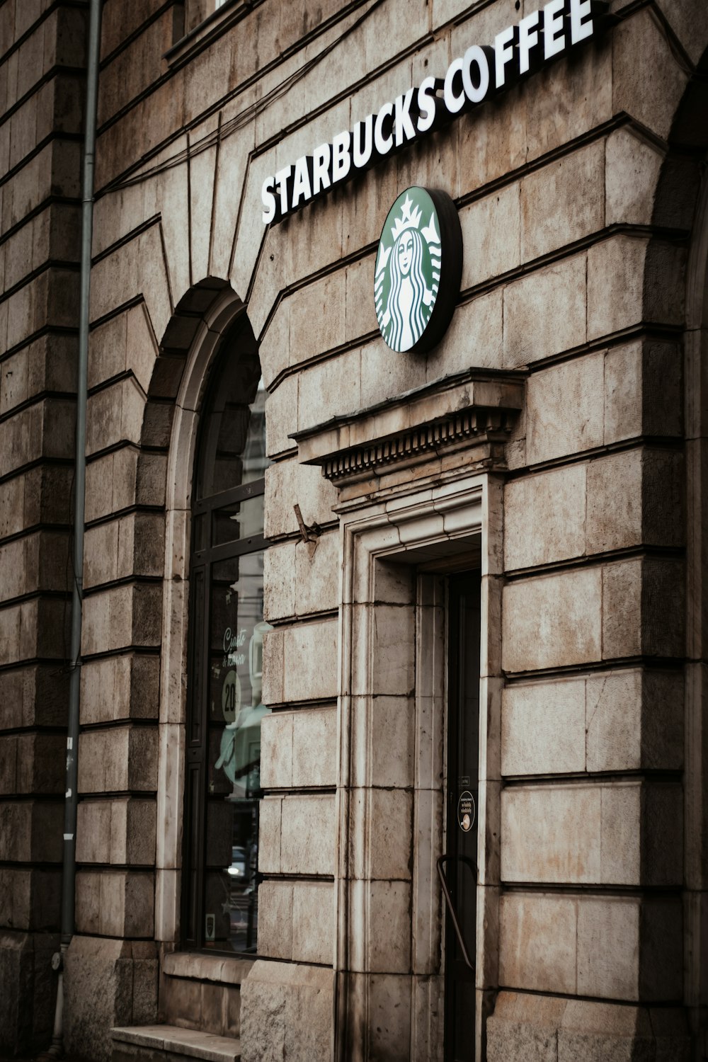 brown brick building with brown wooden door