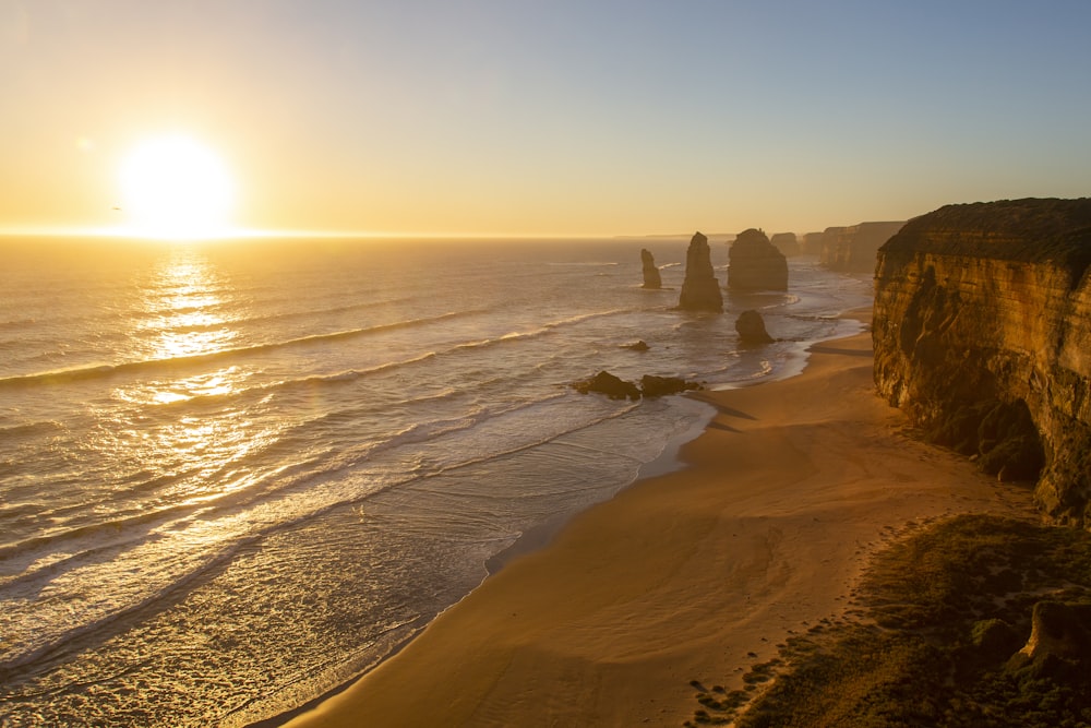 brown rock formation on seashore during daytime