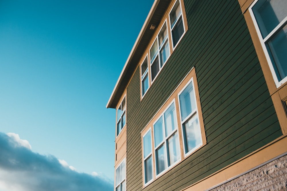 brown and white concrete building under blue sky during daytime