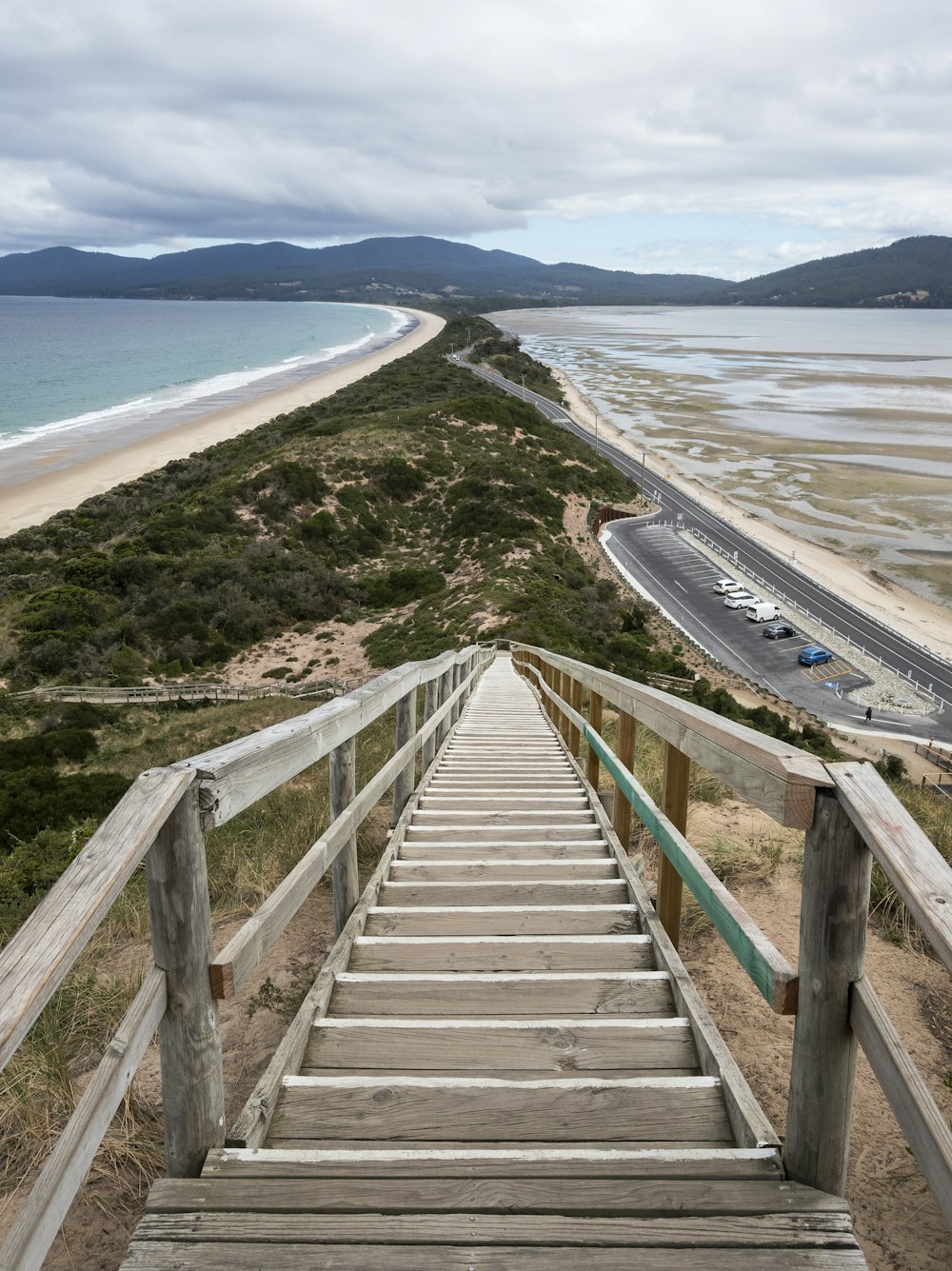 gray wooden bridge over the sea during daytime