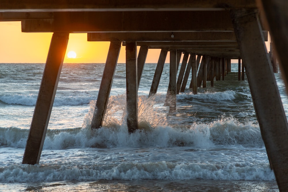 brown wooden dock on sea during daytime