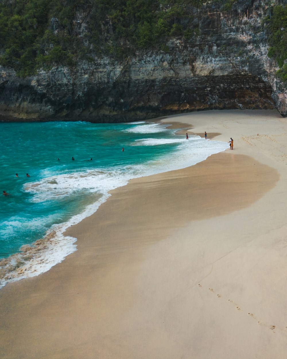 person walking on beach during daytime