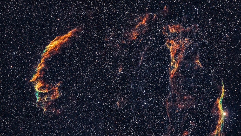 orange and black galaxy illustration