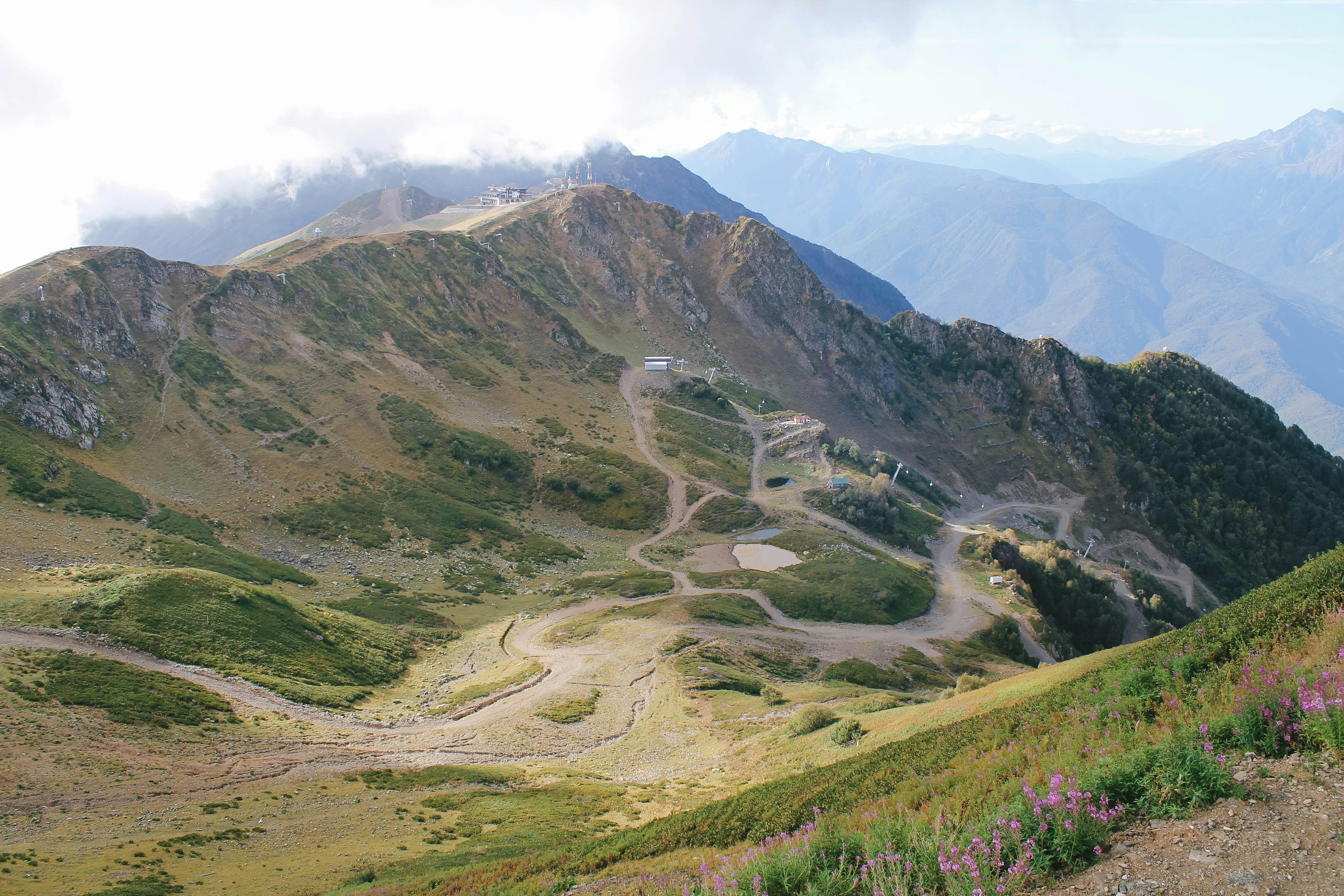 green and brown mountains under white sky during daytime