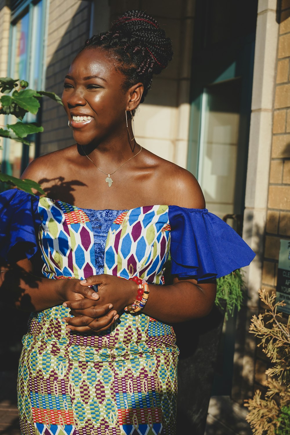 woman in blue and white off shoulder dress