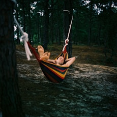 woman in white and blue striped hammock