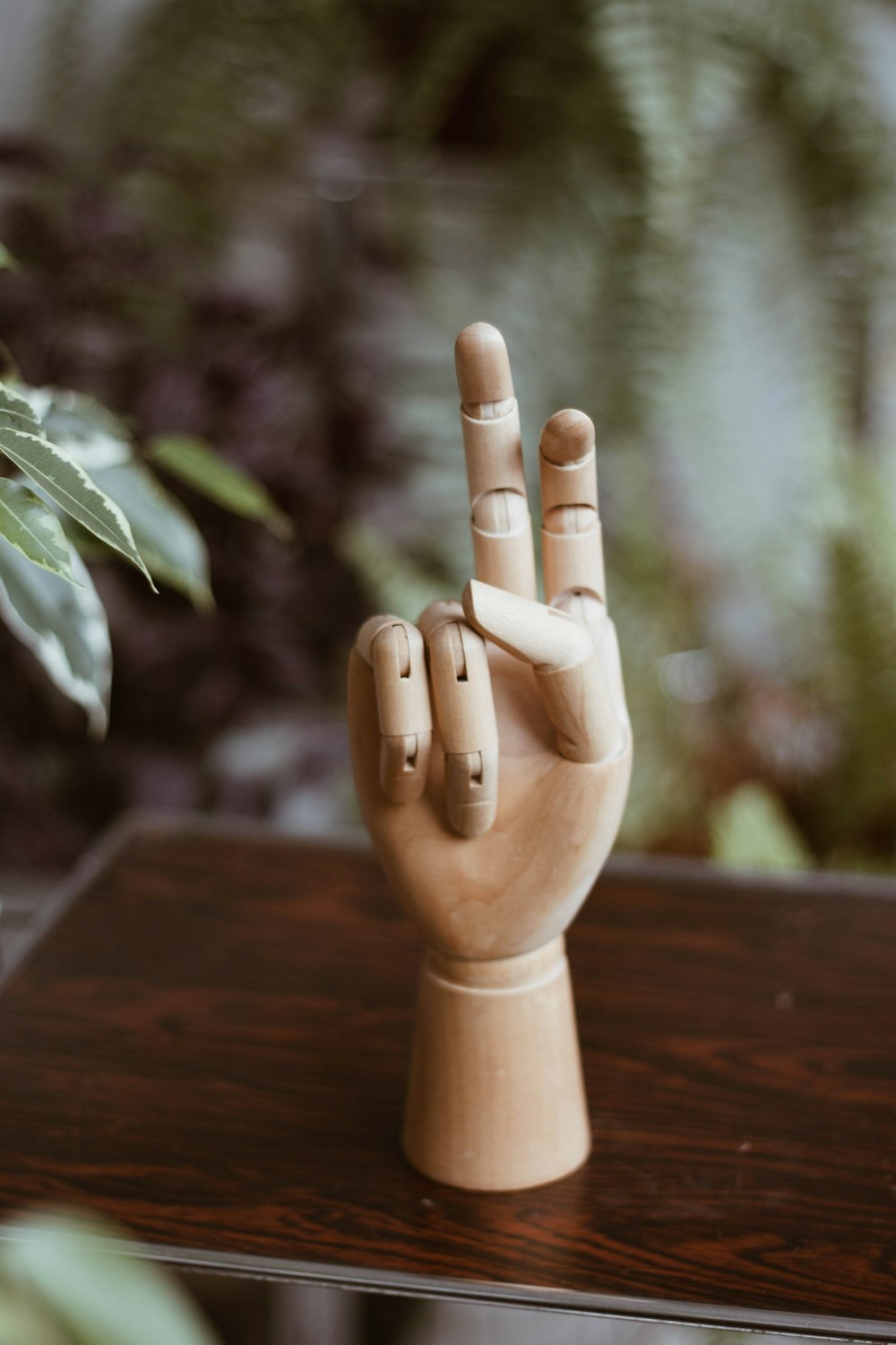 brown wooden figurine on brown wooden table