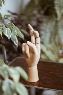 brown wooden figurine on brown wooden table