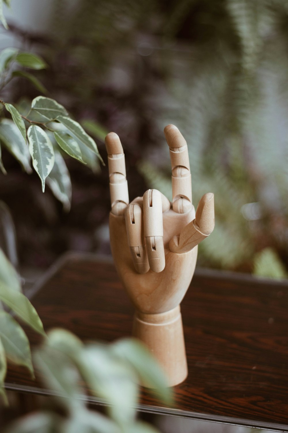 brown wooden human hand figurine