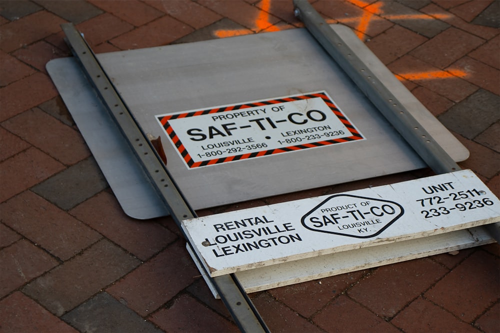 white and black wooden signage