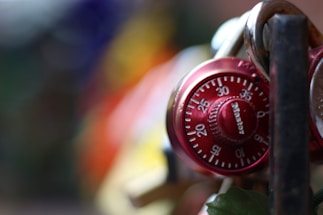 Close-up of a sleek digital biometric lock glowing softly against a dark background.