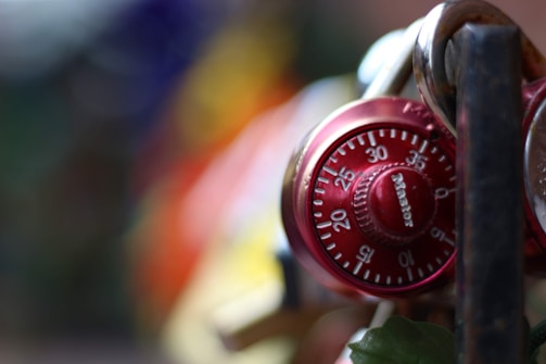 Close-up of a sleek digital biometric lock glowing softly against a dark background.