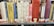 A row of books on a library shelf, featuring various titles related to Shakespeare and other literary topics. The books are in a mix of colors, and there are labels on the spines indicating their library classification.