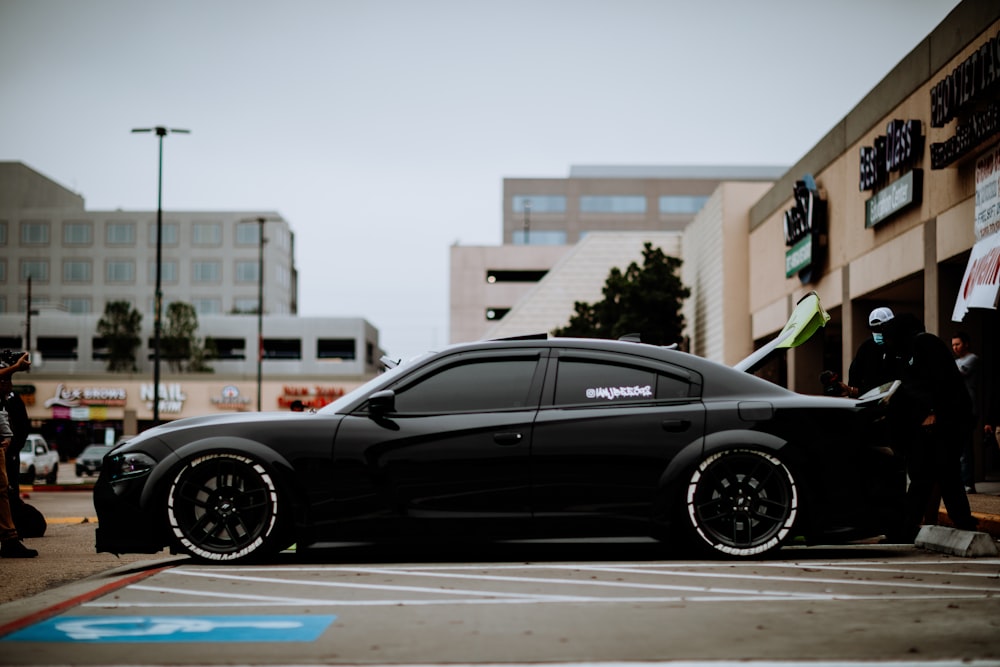 black sedan on road during daytime