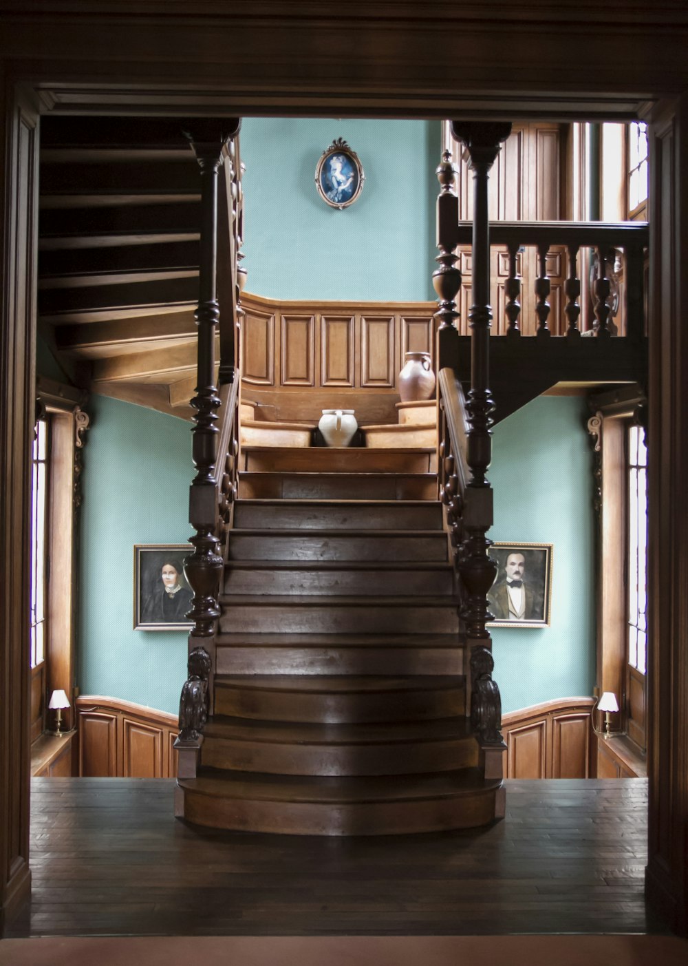 brown wooden staircase near brown wooden staircase