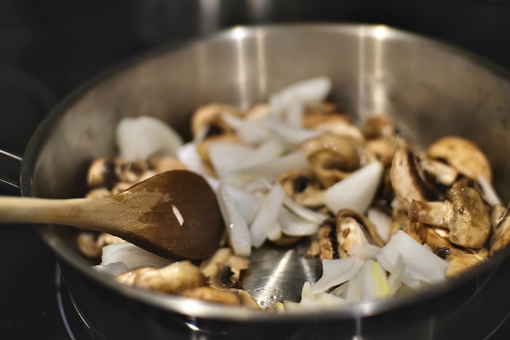 brown and white mushroom in stainless steel bowl
