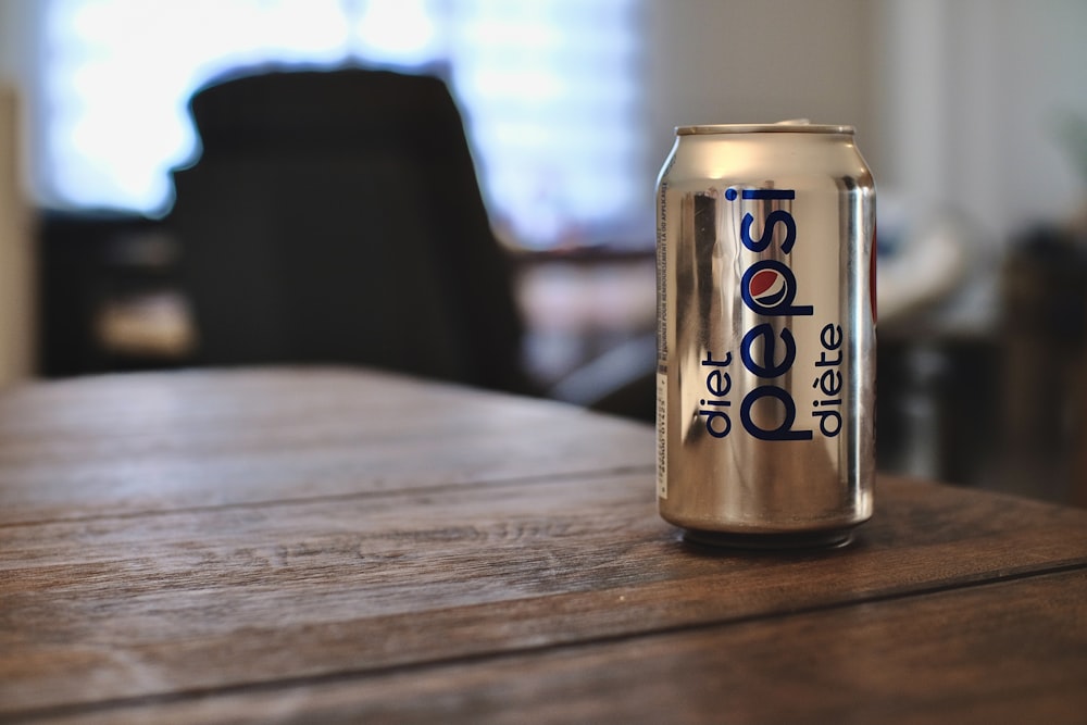 diet coke can on brown wooden table