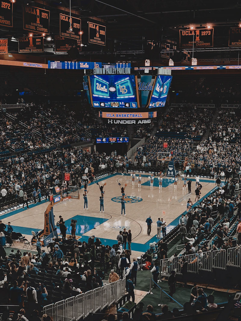 People playing basketball on a basketball court