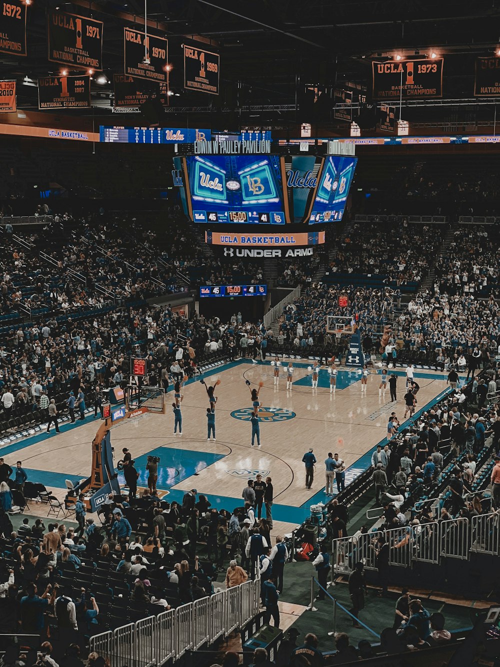 people playing basketball on basketball court