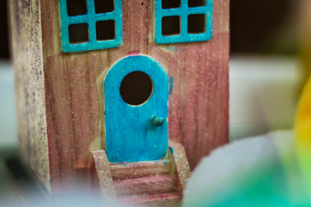 brown wooden bird house on brown wooden table