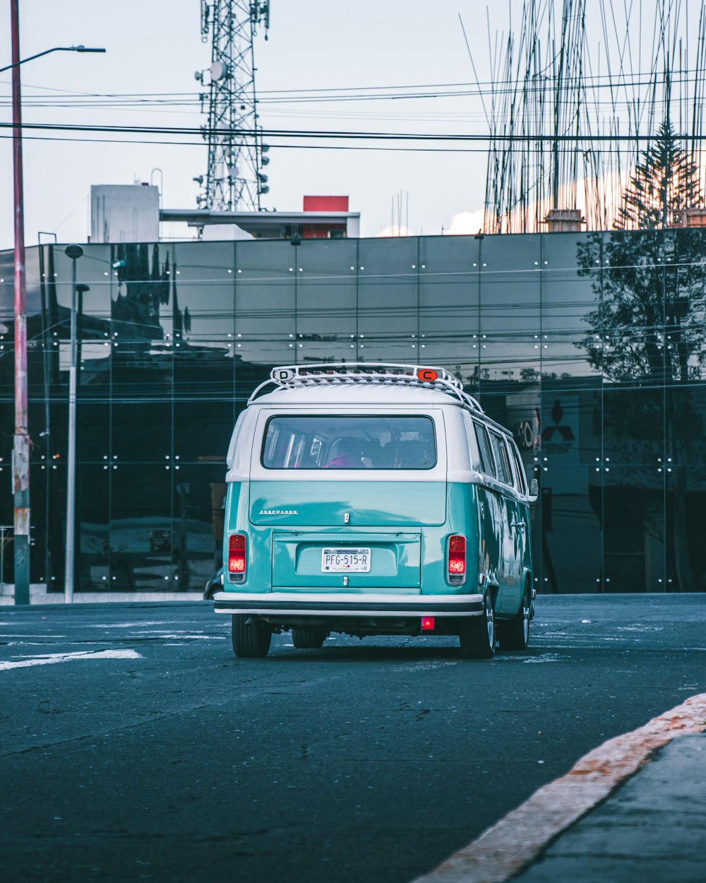 white and blue van on road during daytime