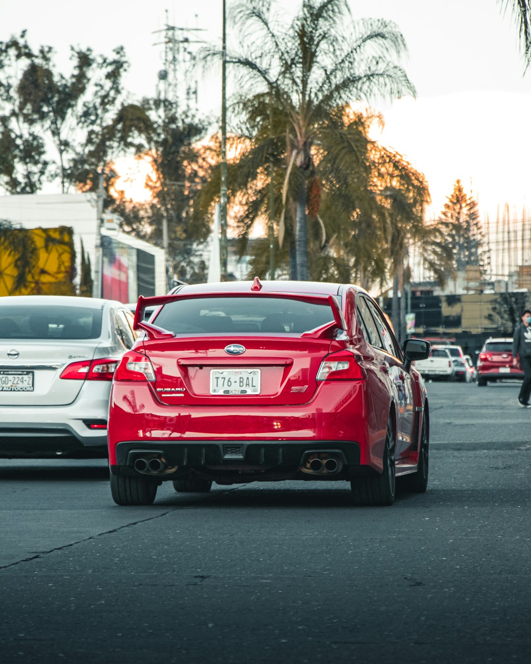 red bmw m 3 on road during daytime