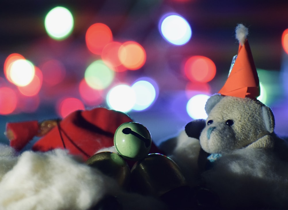 white bear plush toy with red and white santa hat