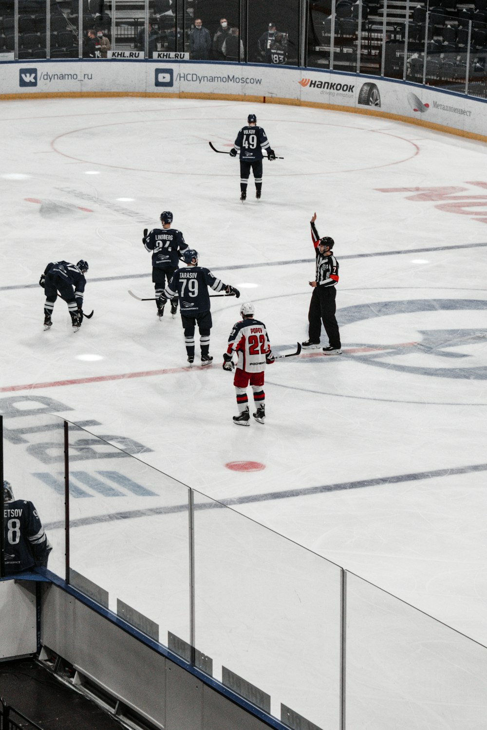 people playing ice hockey on ice field