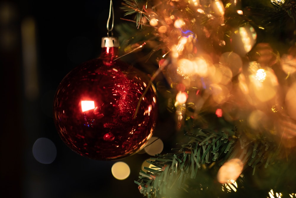 red baubles on green christmas tree