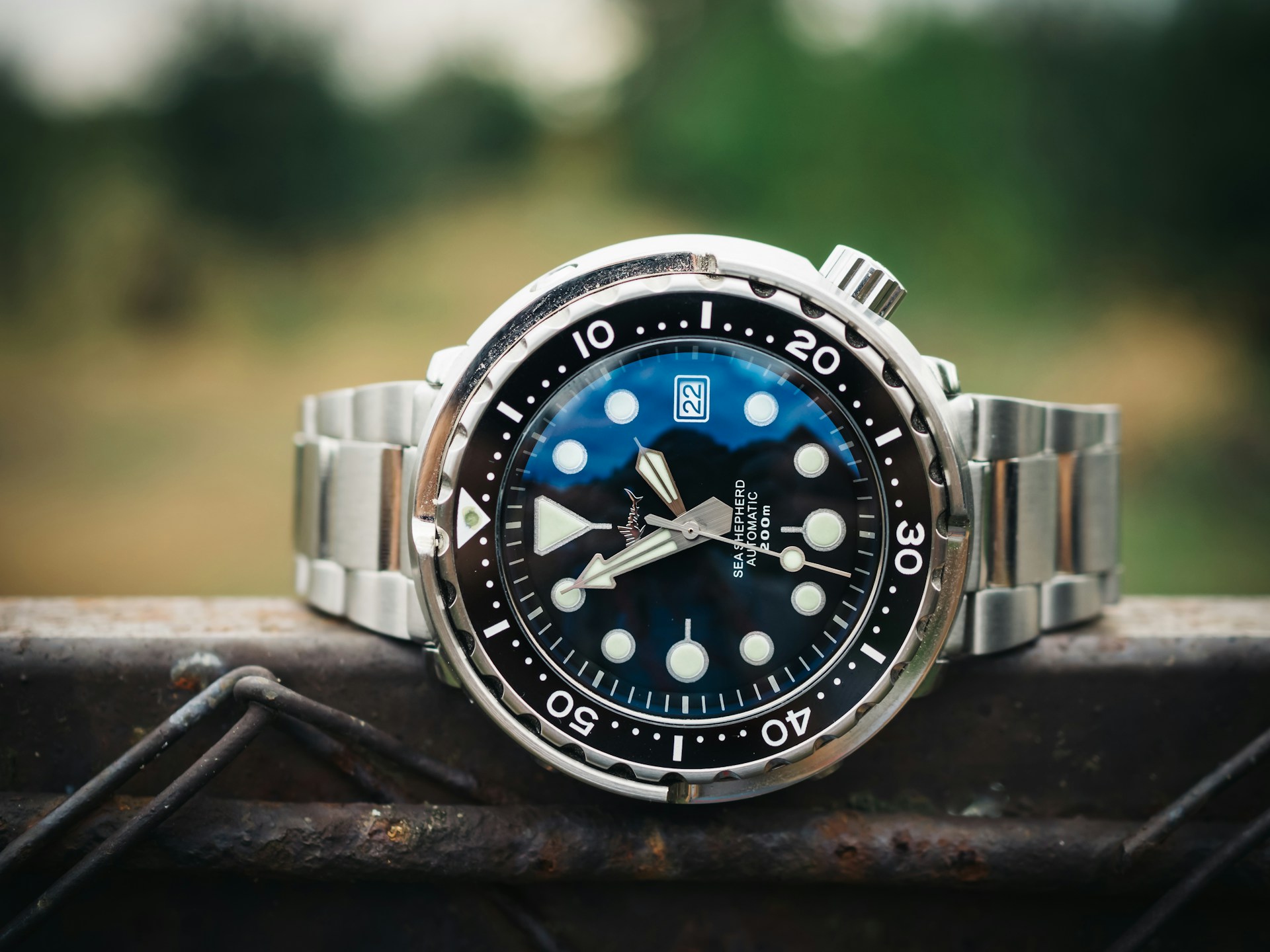 blue and silver round analog watch