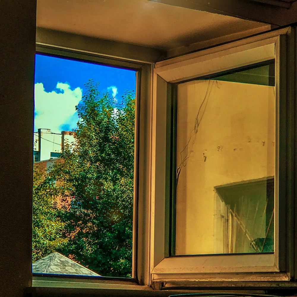 white wooden framed glass window