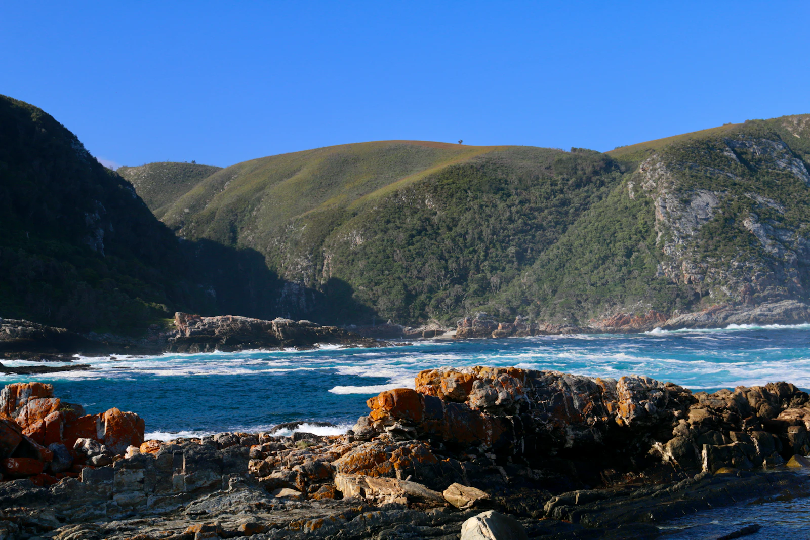 Storms River coastline with green cliffs above the Indian Ocean