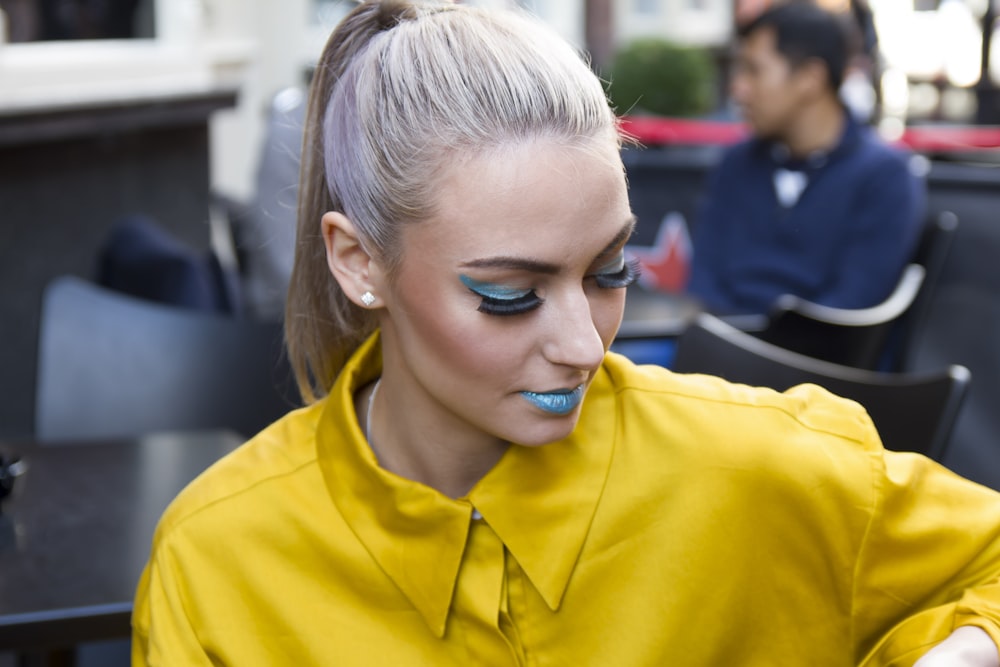 girl in yellow hoodie with blue eyes