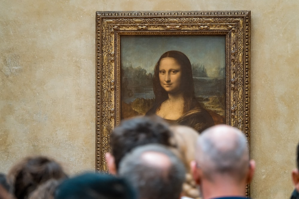 woman in black top standing near people