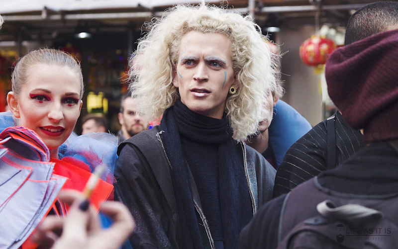 Femboy in black hoodie smiling