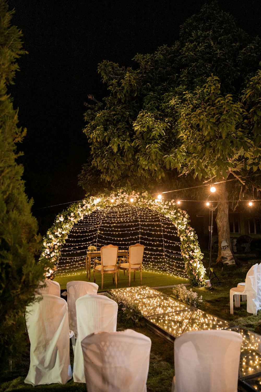 white chairs and table with white table cloth