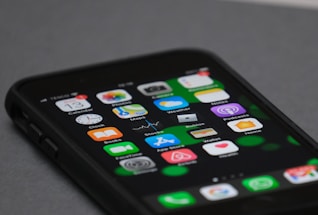 black iphone 4 on white table
