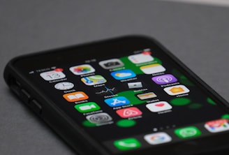 black iphone 4 on white table