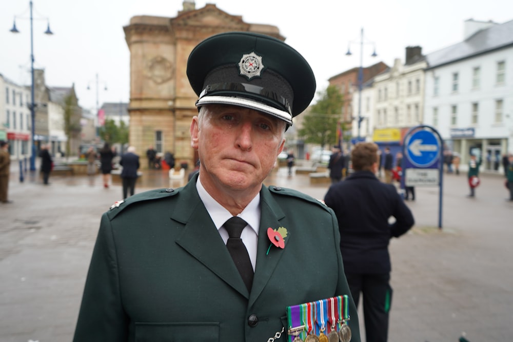 man in black uniform wearing black hat