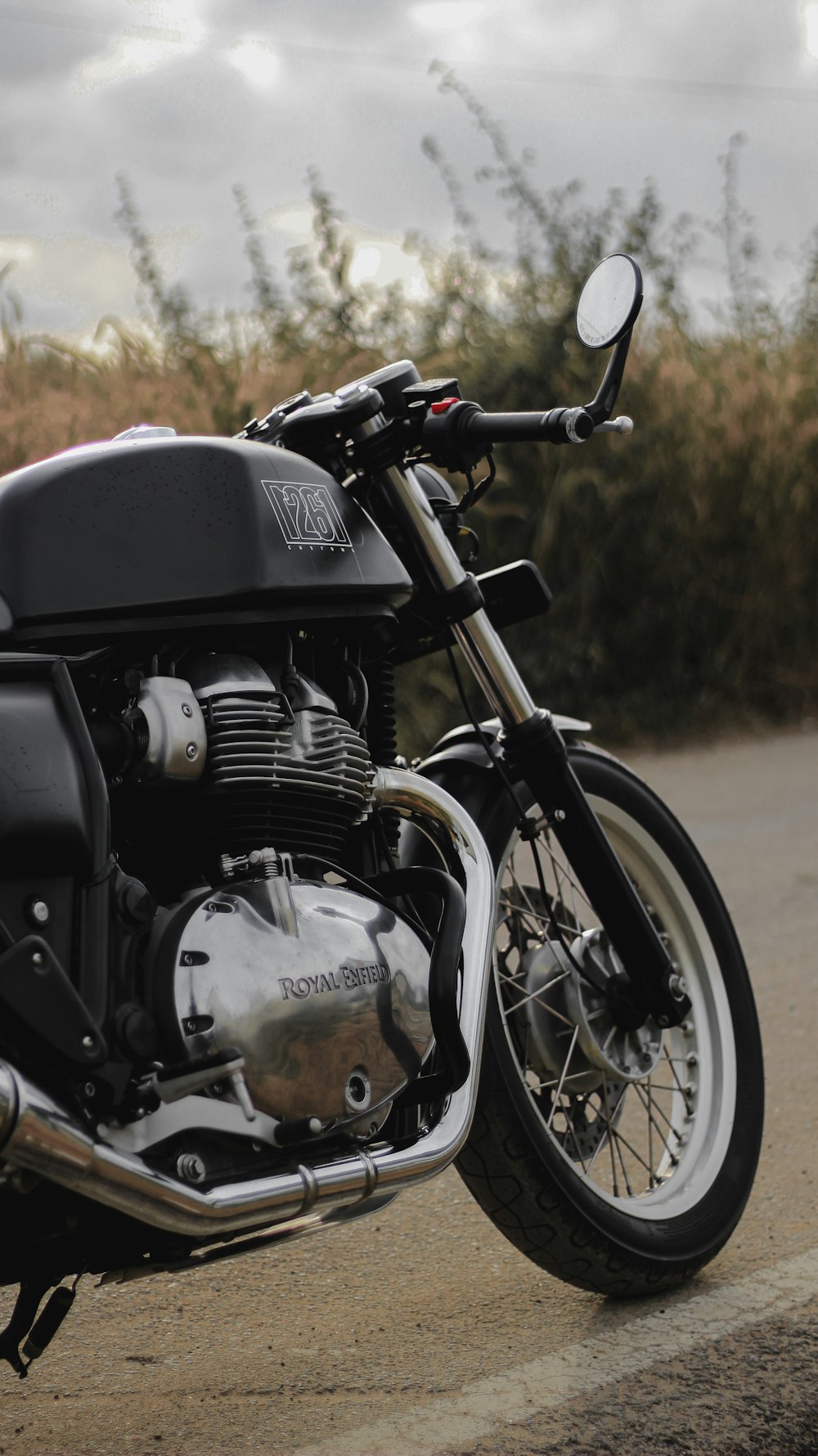 black and silver motorcycle on brown dirt road during daytime