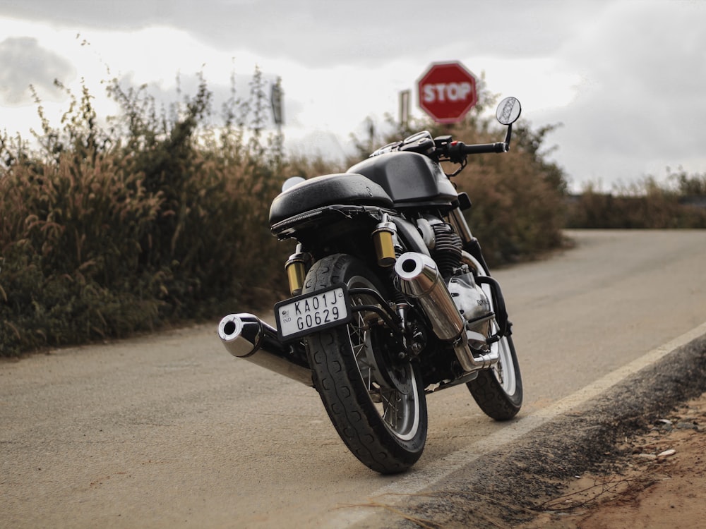 black and silver cruiser motorcycle on road during daytime