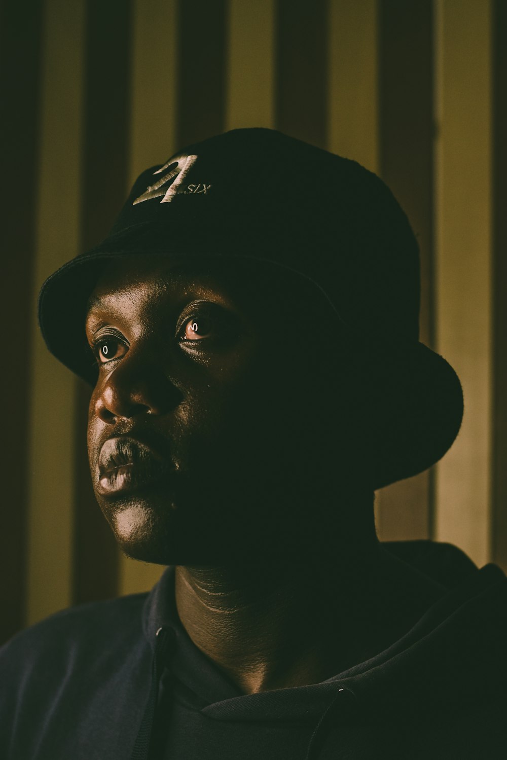 man in black and white fitted cap