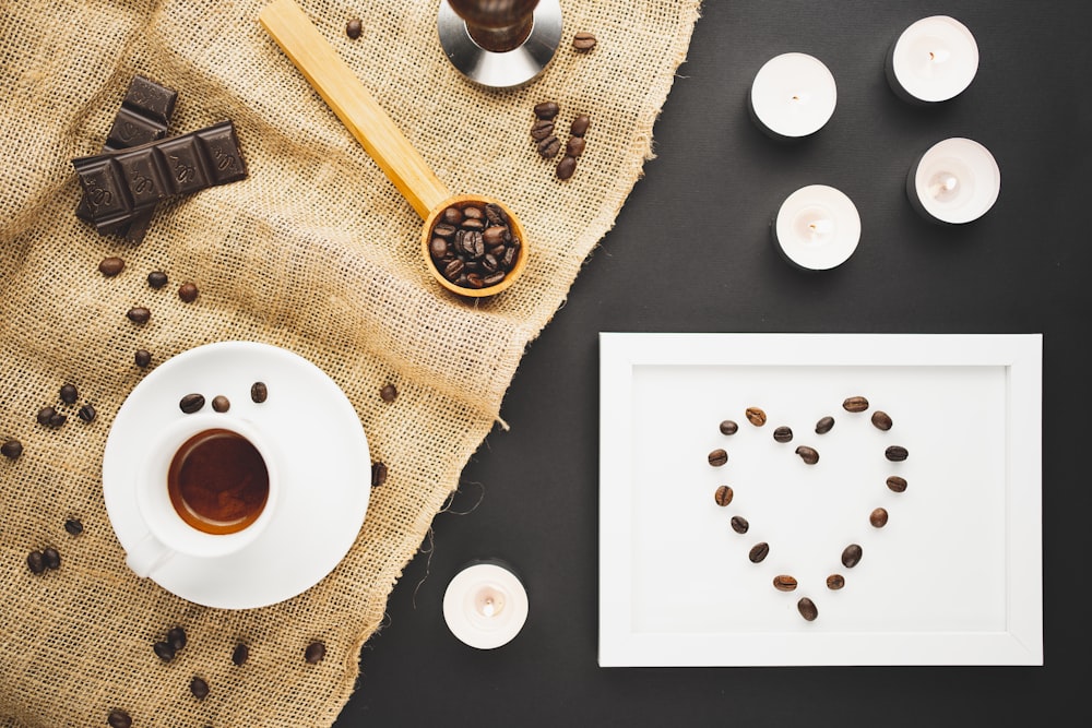 white ceramic mug on white and brown round table mat